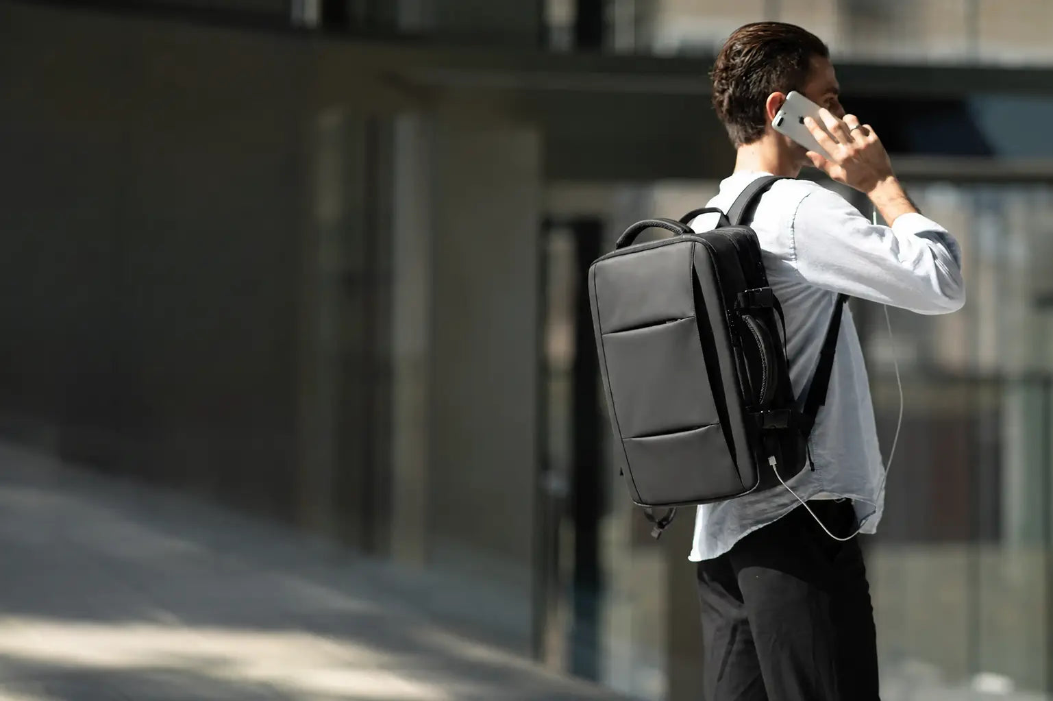 Urban commuter wearing the black expandable backpack